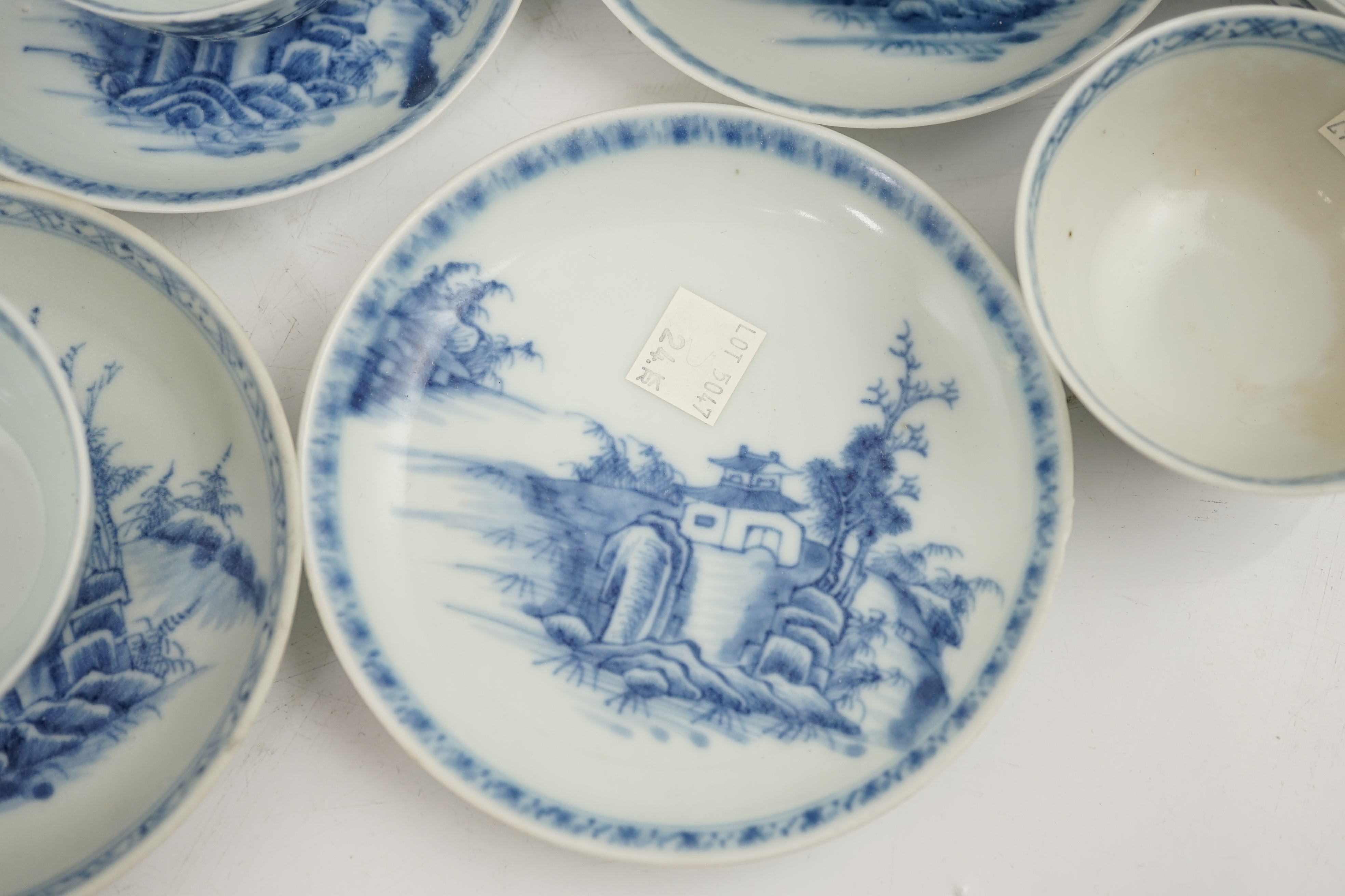 A set of twenty four Chinese Nanking Cargo blue and white ‘large pagoda’ tea bowls and saucers, Qianlong period